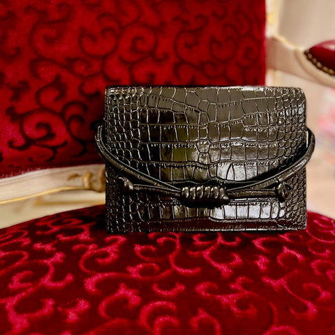 https://www.esinakan.com/products/midi-chelsea-black-croc-leather-clutch-bag?_pos=3&_sid=afe3c7afe&_ss=r