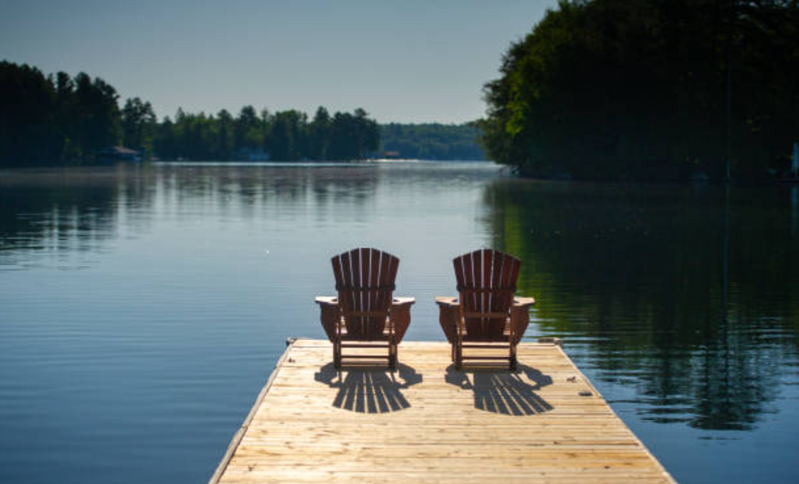 Chairs on a dock overlooking a beautiful lake