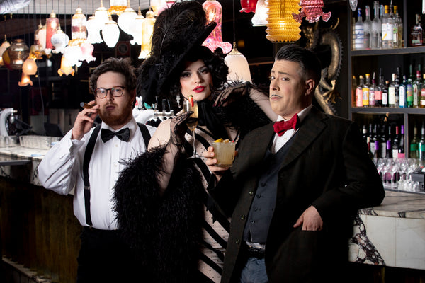 Vintage Gatsby style models at glamorous sydney art deco bar drinking cocktails and smoking cigar. Photo by Tony Palliser and features left to right comedian Jared Jekyll, burlesque dancer Eva Devore and salon juggler Daniel Gorski