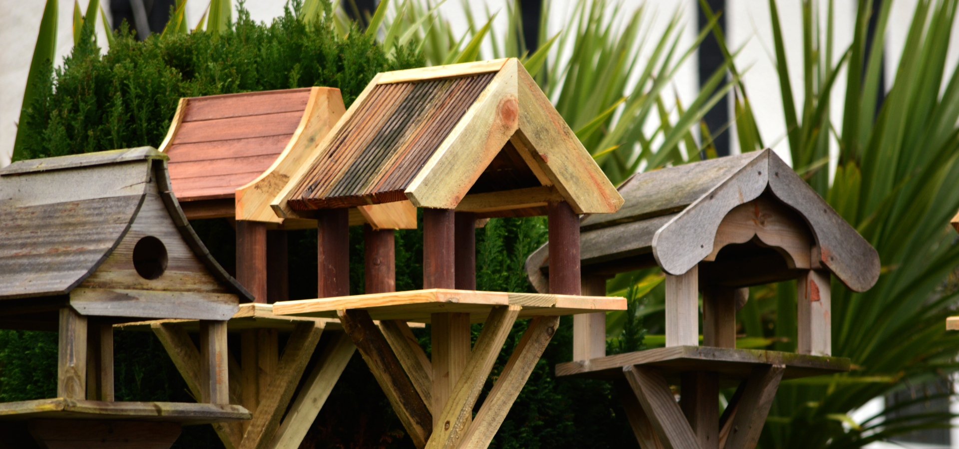 A collection of wooden bird tables