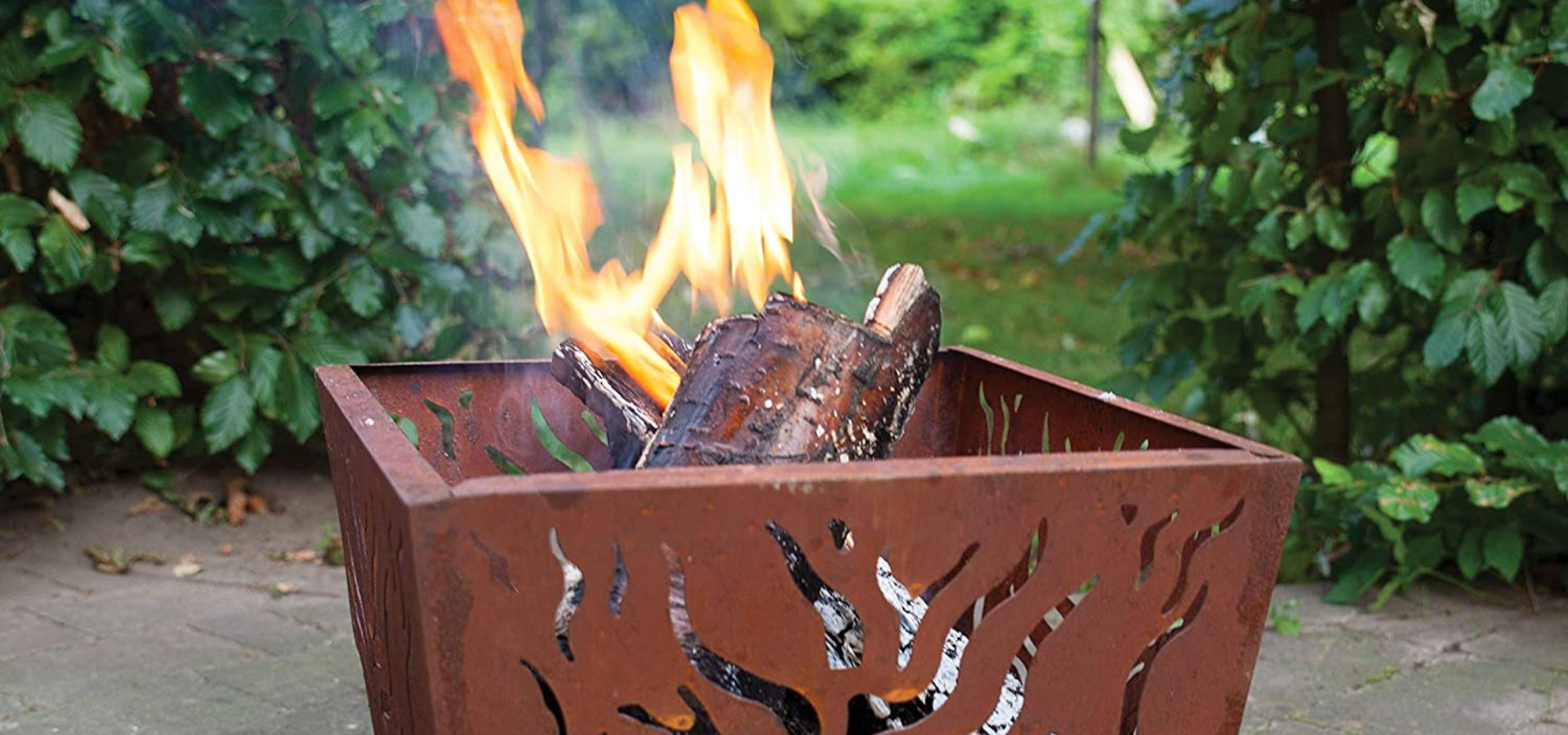 A lit square fire pit