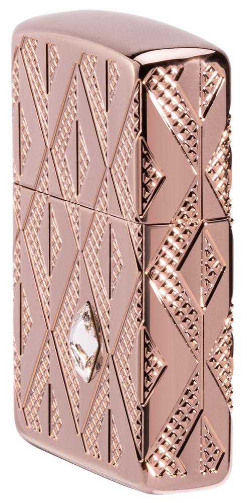 Geometric Diamond Pattern Design Armor® Rose Gold Windproof Lighter standing at an angle, showing the front and right side of the lighter.