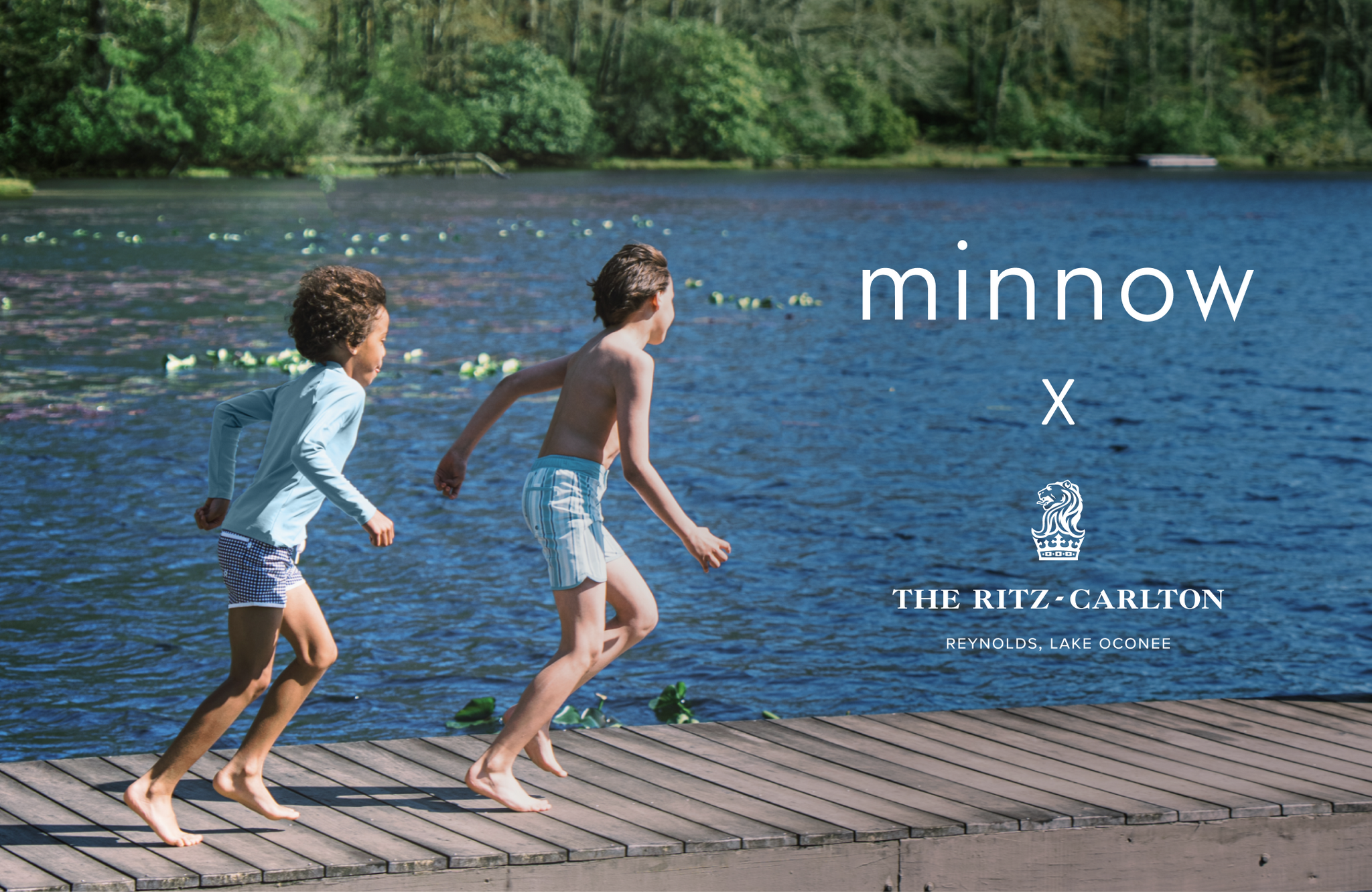 two boys wearing minnow swim running on dock to the lake. featuring minnow x ritz carlton reynolds