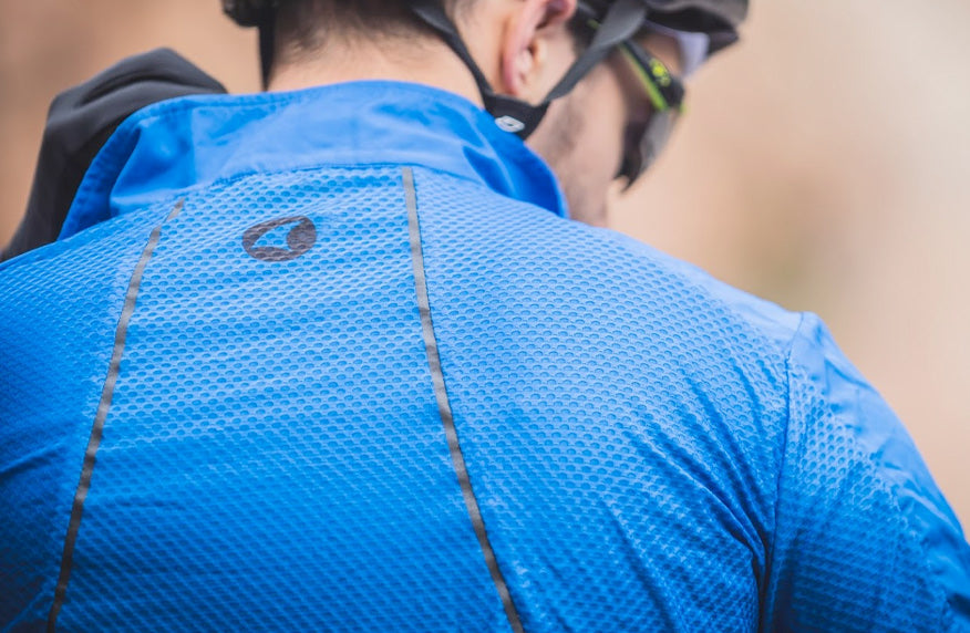 Rear-view of the Divide Wind Jacket showing the mesh material and reflective taping