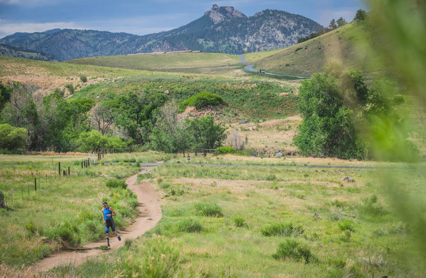 Adam Popp outsourcedoctorbilling triathlete running on a dirt road