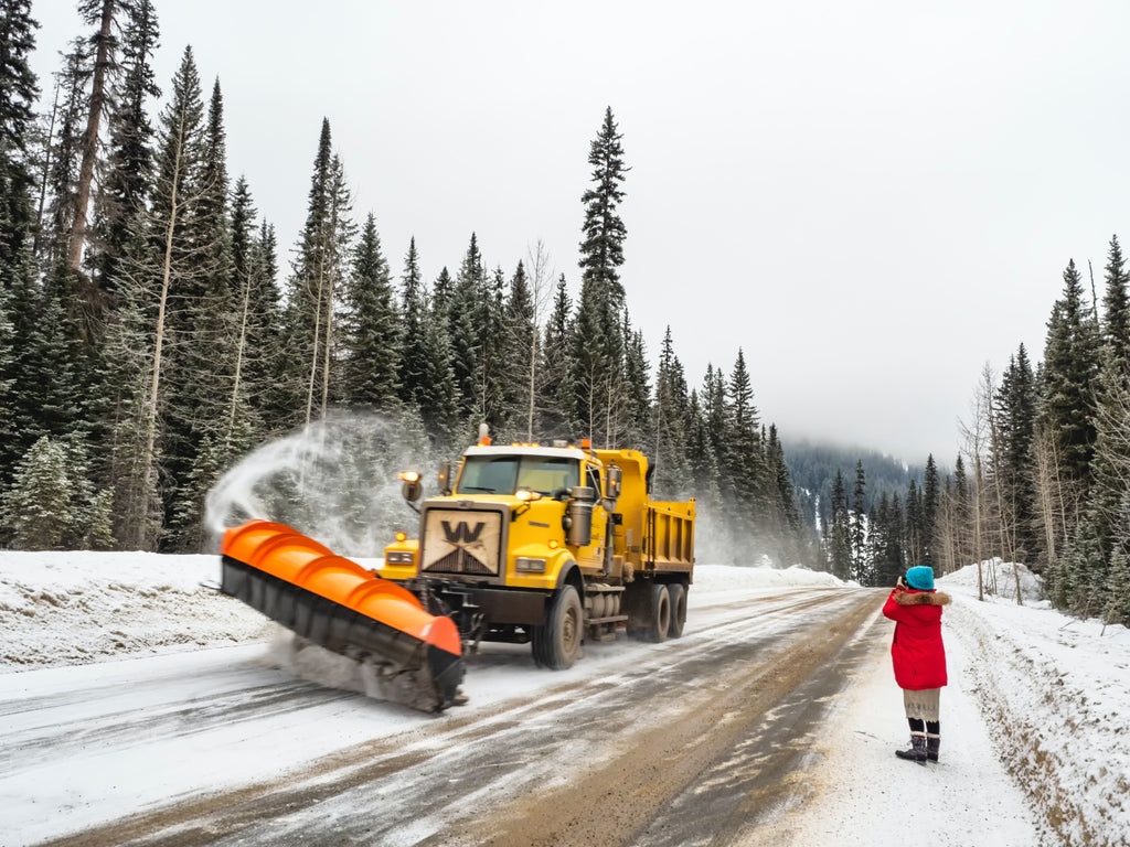 Vehicle Removing Snow From Road