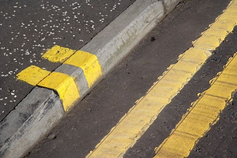 Double yellow lines on the road with blips