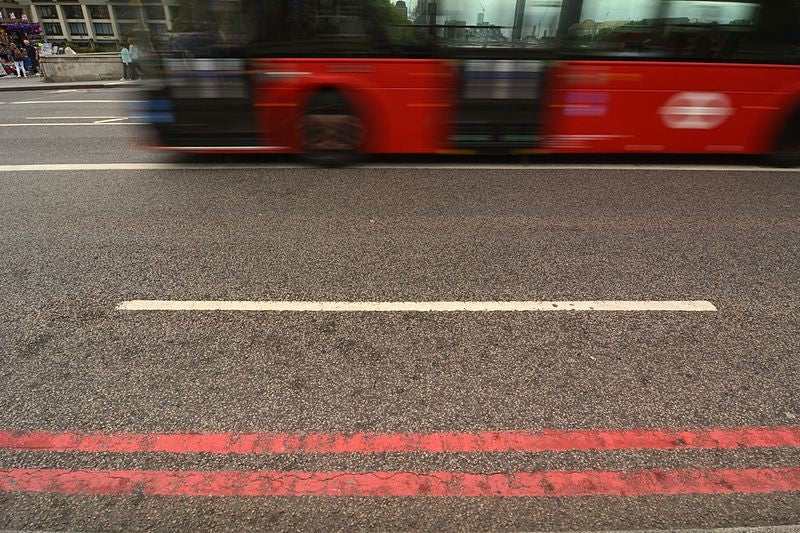 Double red line bus route with london bus
