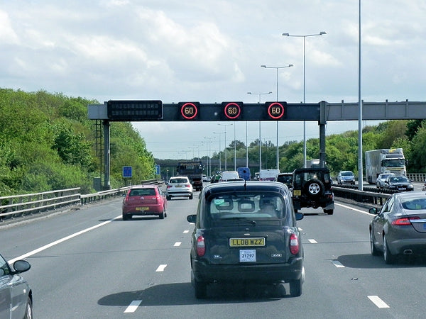 Variable speed limit sign on motorway