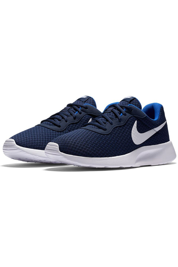 navy and white nike shoes