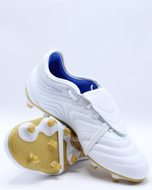 white and gold soccer shoes