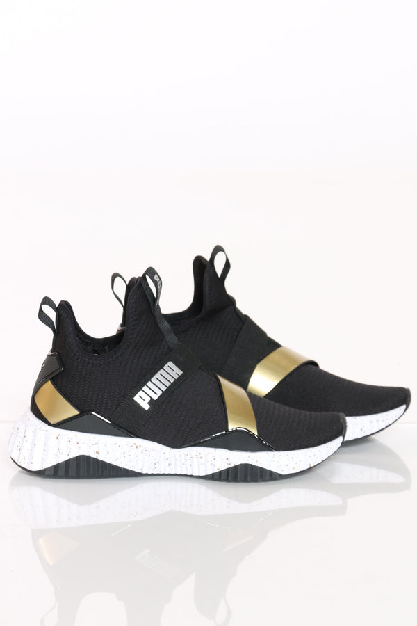 puma defy black and gold