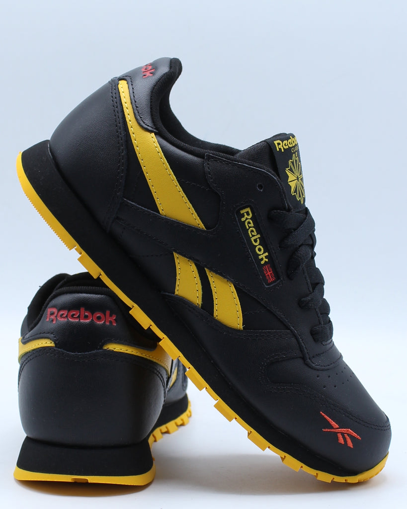 black and yellow reebok shoes