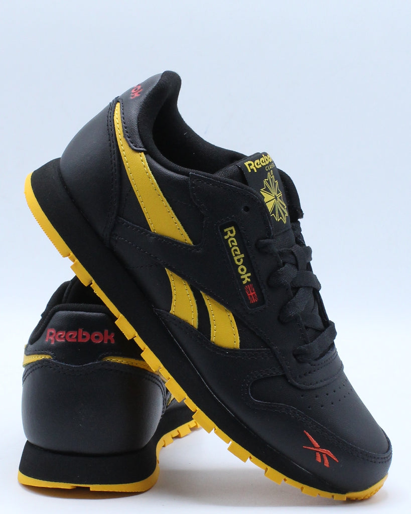 reebok black and yellow shoes