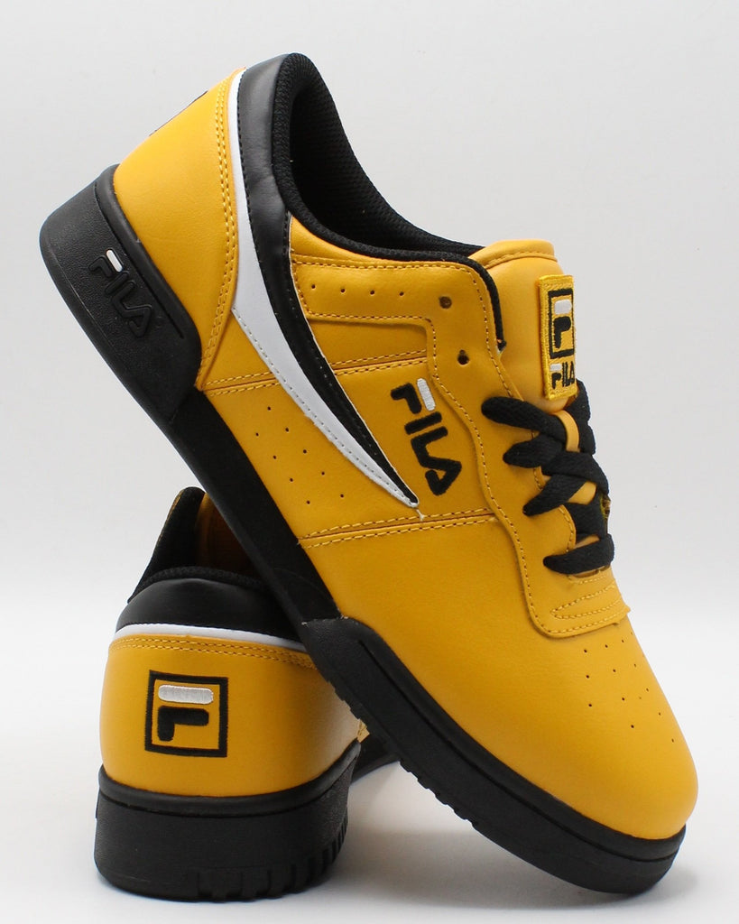 yellow and black fila shoes