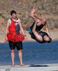 www.unshoesusa.com - Terral Fox with a hallmark backflip into the refrigerator, while paddler and Ballet Master Chris Hall scrutinizes form.