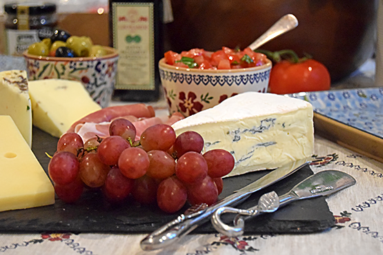 Cheese board with grapes