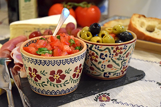 Nicholas Mosse Pottery Custard Cups Old Rose and Wild Flower Meadow used for tapas, filled with tomatoes, basil and olives