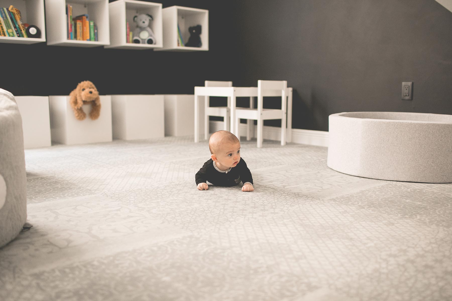 baby crawling on play mat