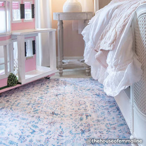 Blue and blush vintage floral print baby play mat shown in girls bedroom with dollhouse.