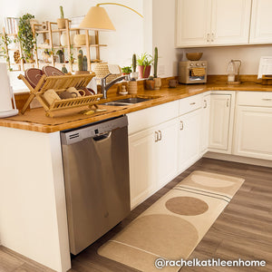 Geode Sesame beige, tan, and brown geometric line print standing mat shown in size 22x72 in front of kitchen counter