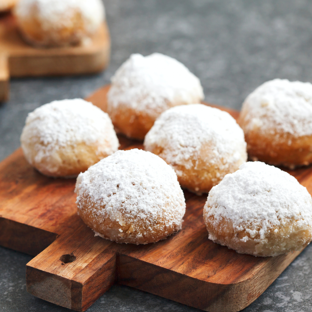 Bite sized cookie balls sprinkled with powdered sugar