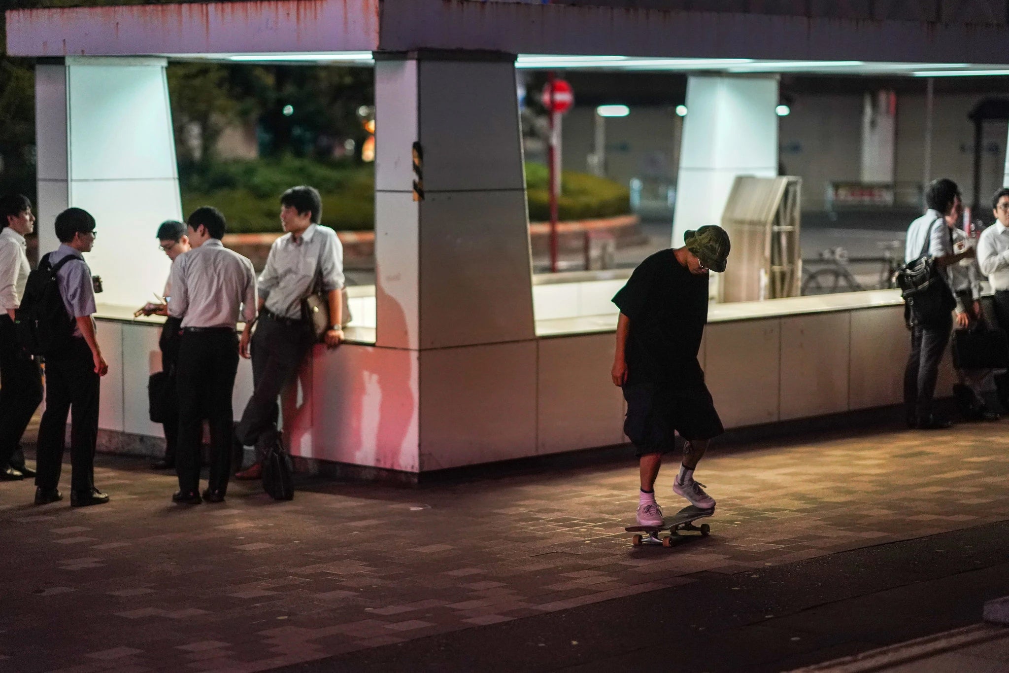 A lone skateboarder outside the Shinjuku subway station. Skateboarding on the street is considered “meiwaku-koui” — bothersome behavior.