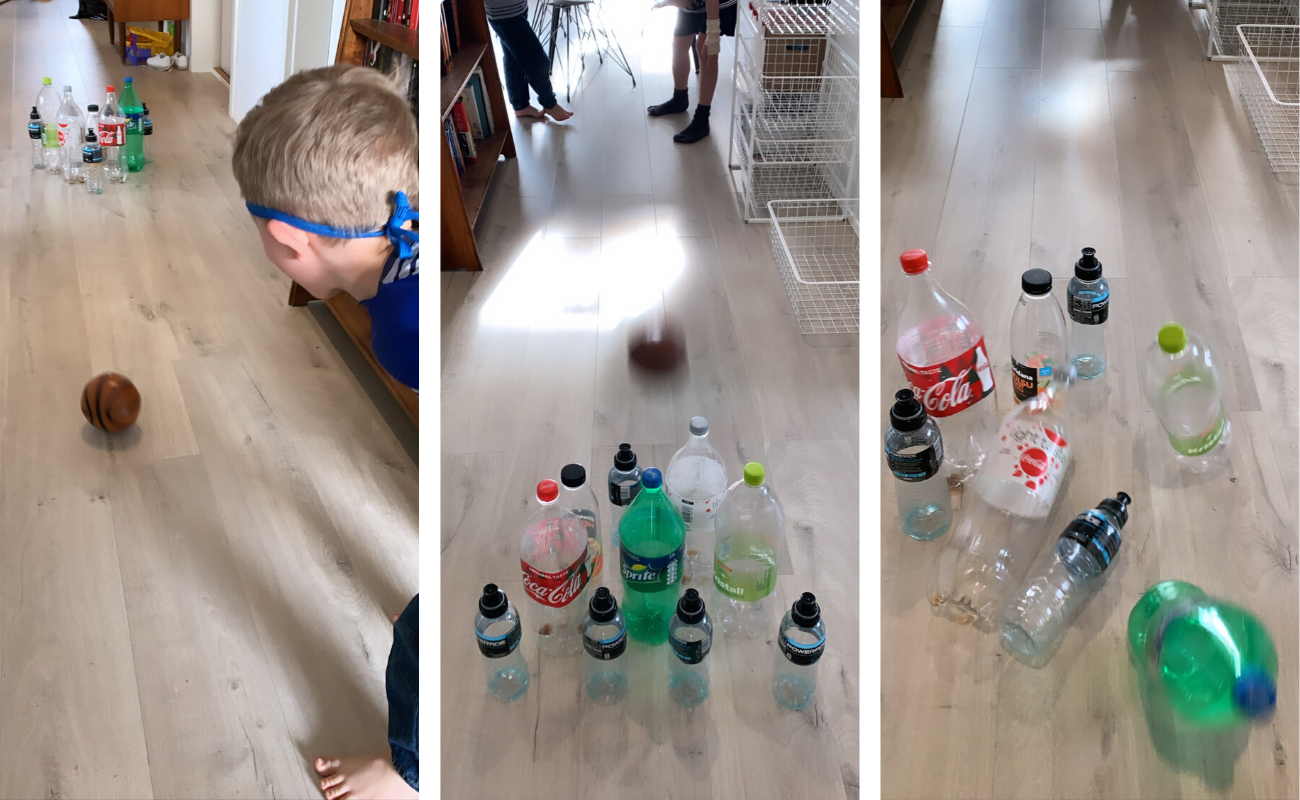 Kids playing bowling with bottles