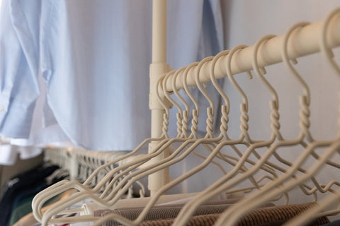 Custom walk-in solution in iron beige with hangers