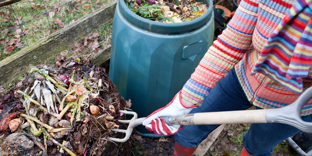 MABLE Compost Blog Post, person shoveling compost from a home composting bin