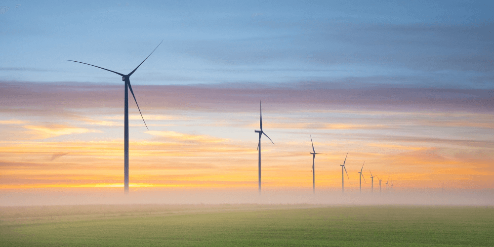 MABLE blog post Bidens climate bill, image of wind turbines in a field during sunset