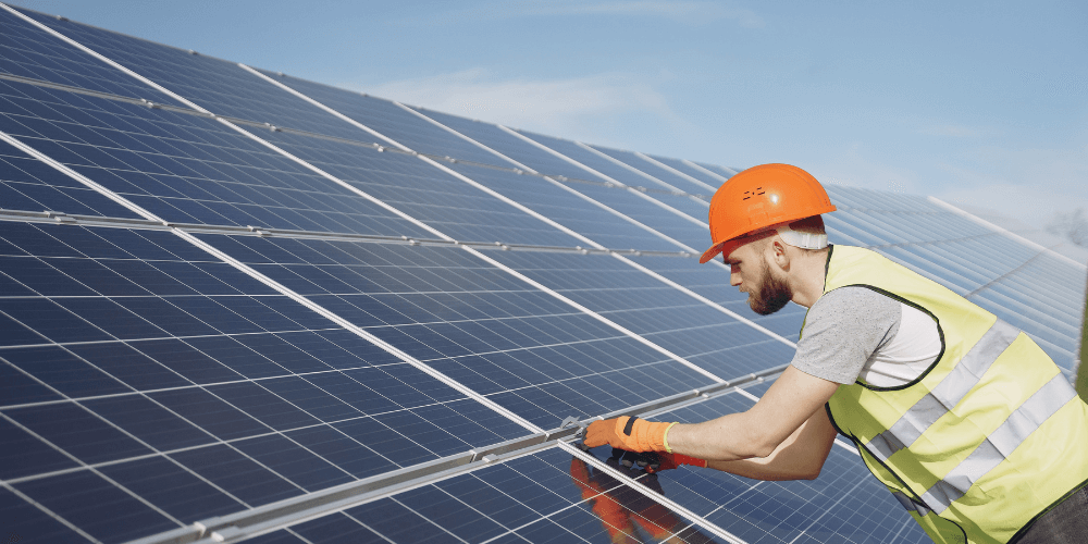 MABLE blog post Bidens climate bill, image of man installing solar panels