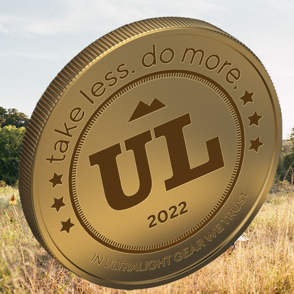 UL coin with take less. do more inscripted around the edges 