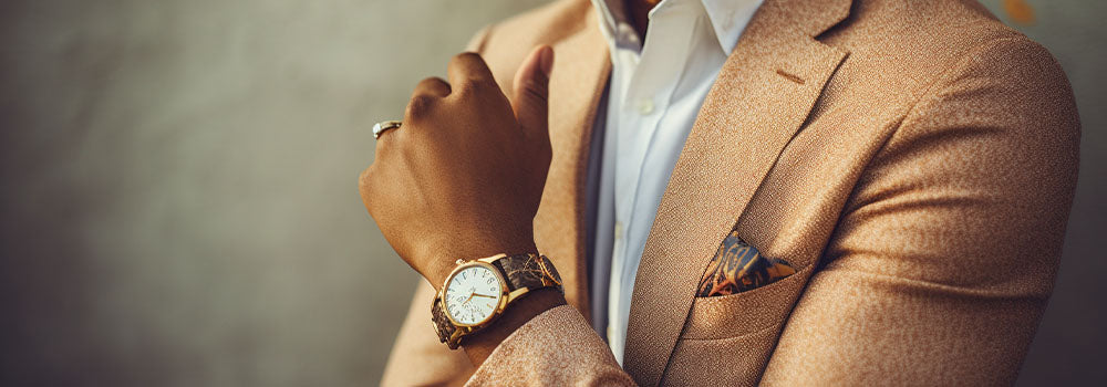 black man wearing gold watch