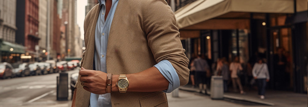 man in new york wearing gold watch for men