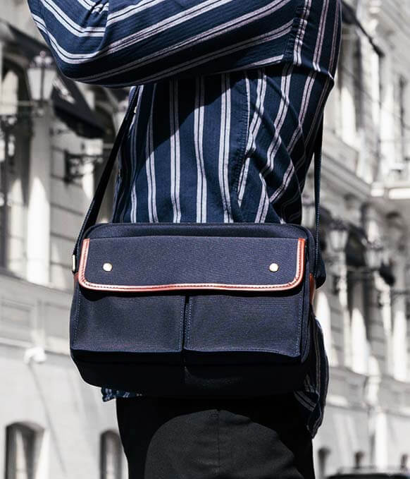 It's not a man purse it's called a satchel vintage t-shirt | Vintage  tshirts, Man purse, Satchel