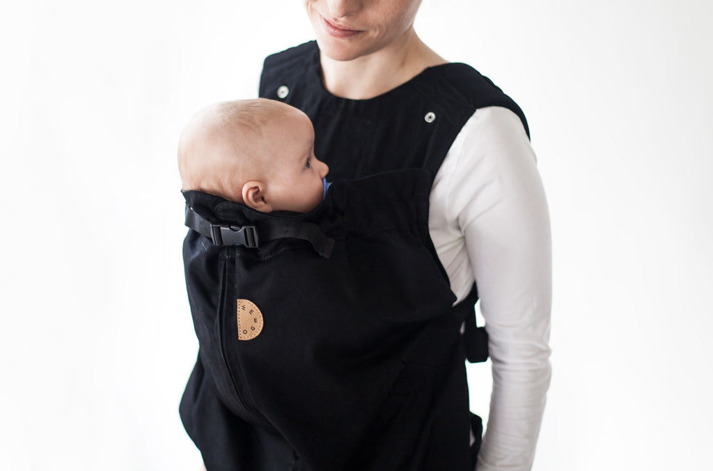 woman carrying baby on her chest in weego original soft baby carrier