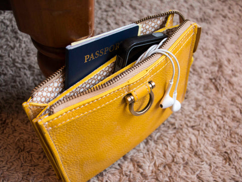 Carry-on items in the Marianne crossbody