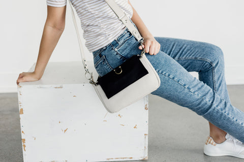 AE crossbody and wristlet wallet in smoke oil and black raw leather.