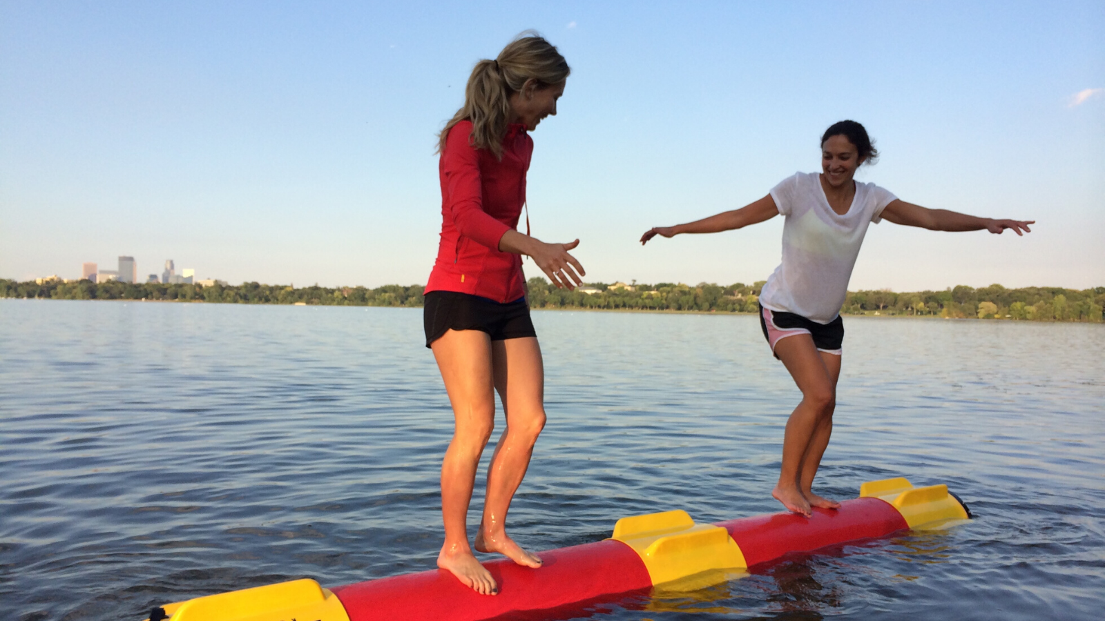 two women log rolling