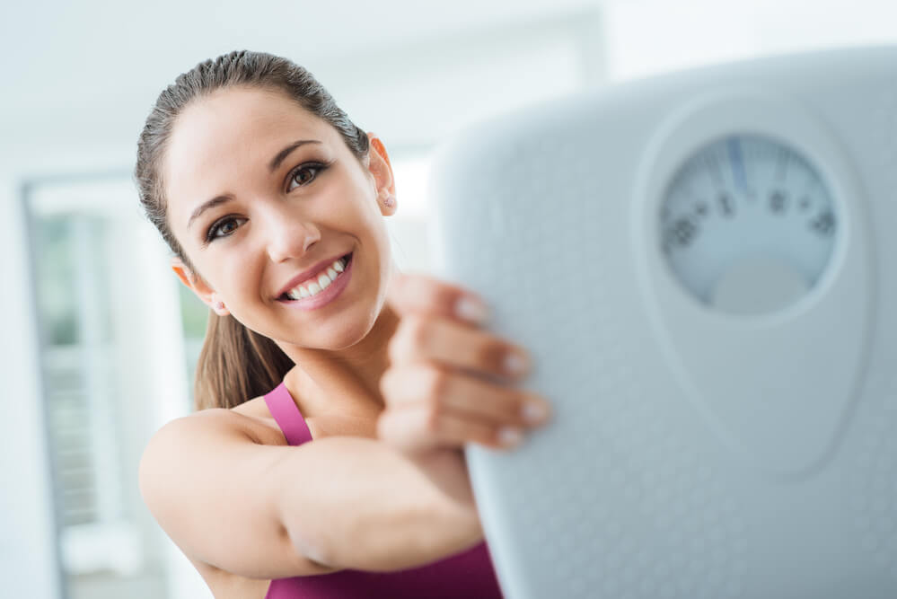 Woman who is happy about her fat loss