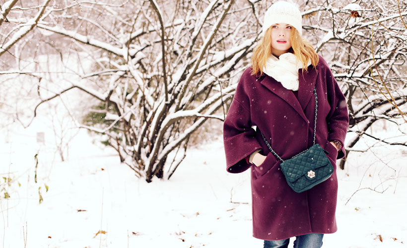 woman wearing purple in warm coat