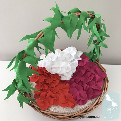 Basket of fabric frangipani flowers