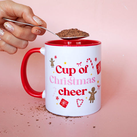 Christmas cup with a spoon of chocolate powder