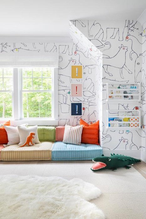 Floor pillows in toddler playroom