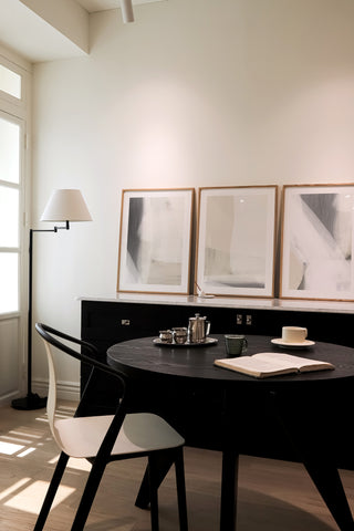 prints on display in a dining area