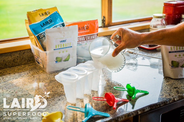 Filling HYDRATE popsicle molds