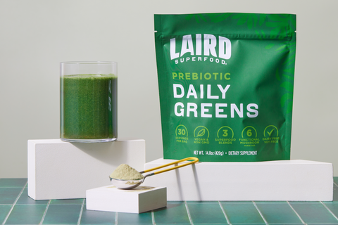 Laird Superfood Prebiotic Daily Greens Product Display with Cool Green Tiles