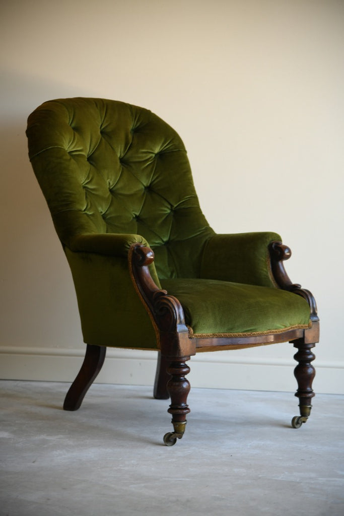 green upholstered armchair