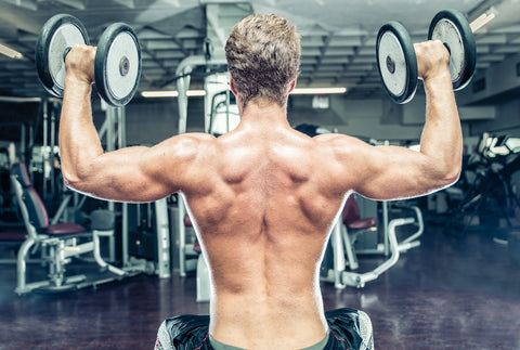 Man lifting dumbbell weights at the gym